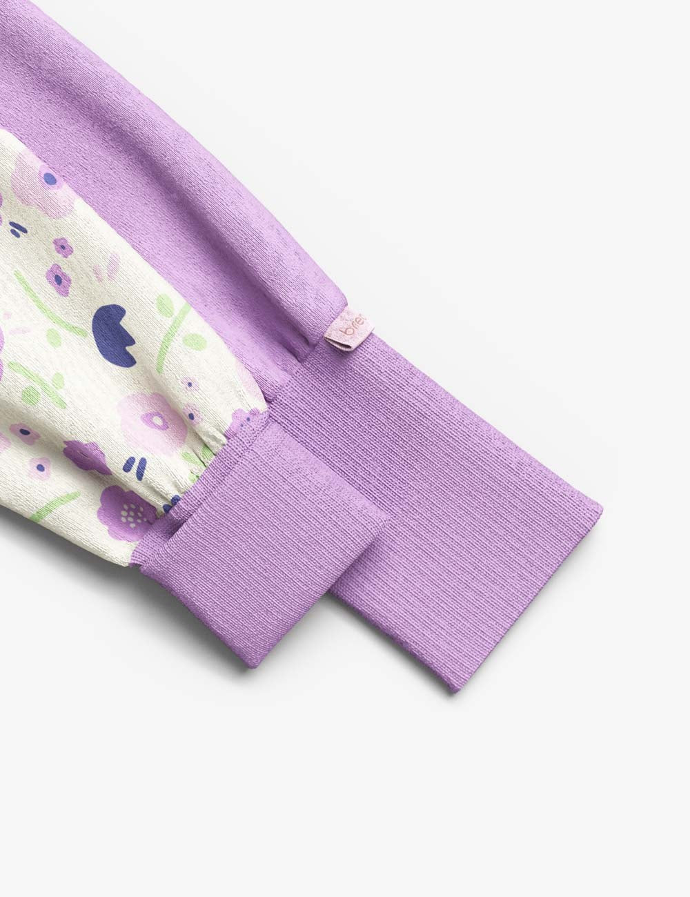 functional baby sleepsuit with summer flowers print and a two-way zipper for easy diaper changes