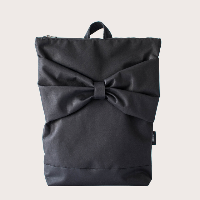 Chic Black Bow Backpack – Stylish & Waterproof for Everyday Use by Muni at www.brixbailey.com