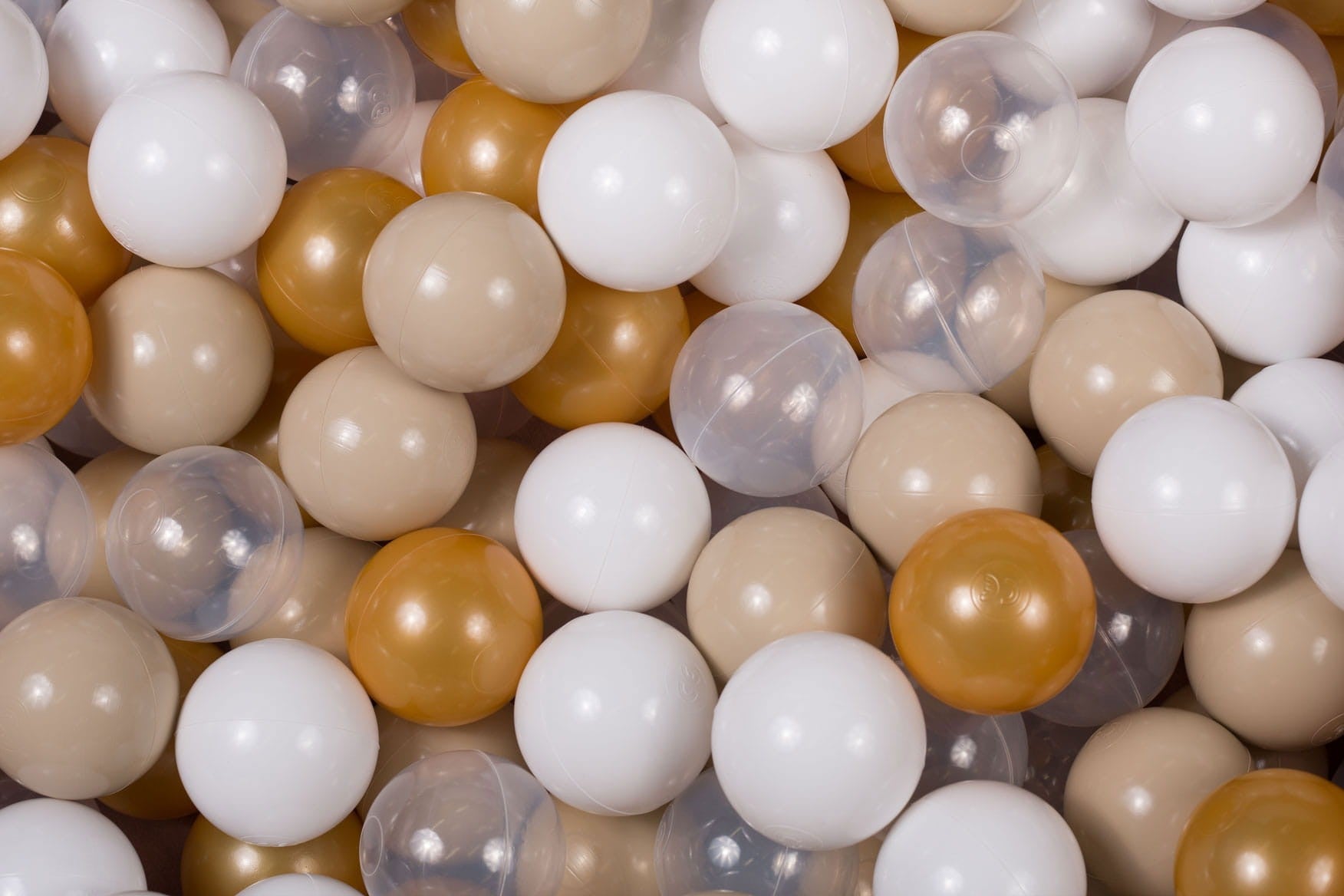 bold overhead shot of 200 beige white and clear ball pit balls for baby playroom