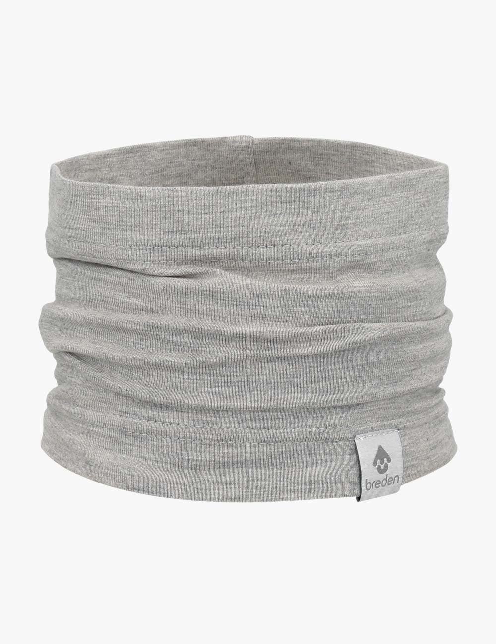 elegant bamboo viscose tube-scarf for kids, draped gracefully on a sunlit summer background