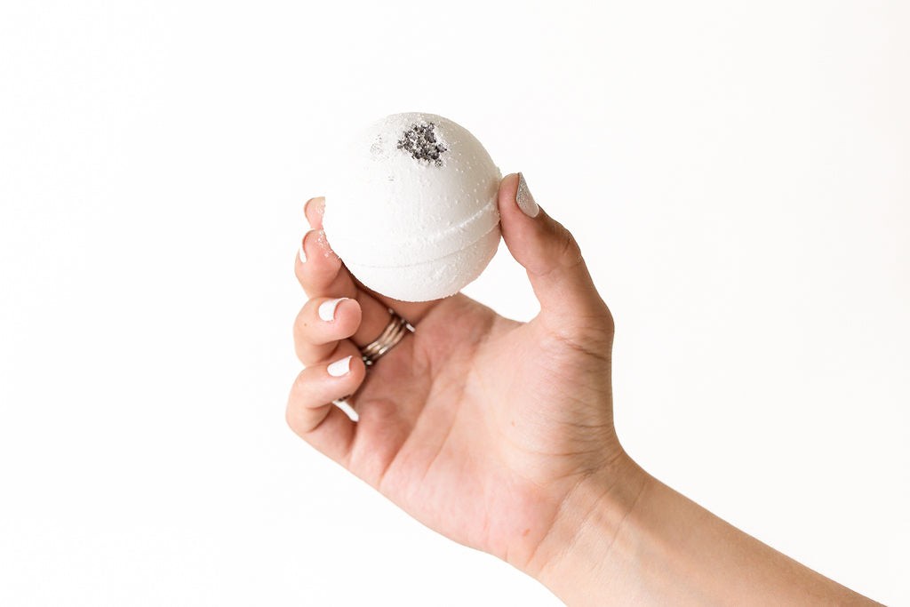 three fizzy bath bombs in a playful splash of vibrant colors and bubbles