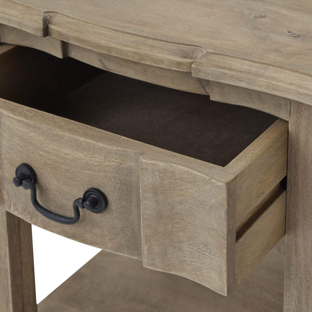 Handcrafted French provincial side table with hardwood construction, bleached wood finish, and black iron handles. by RoomLondon at brixbailey.com