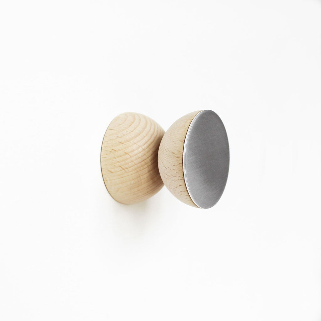 playful modern wall hook with a warm beech wood circle and brushed aluminium arm