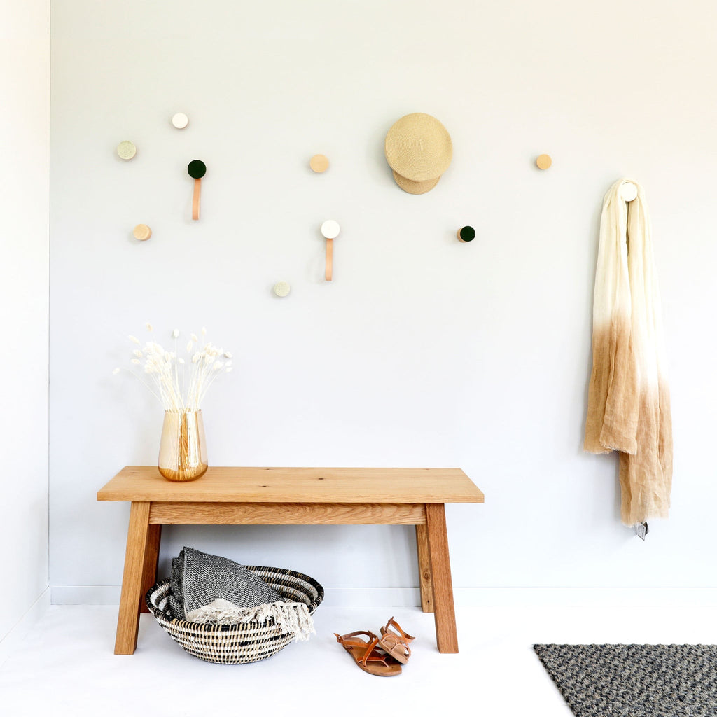 elegant white sand ceramic and beech wood wall hook on a minimalist background