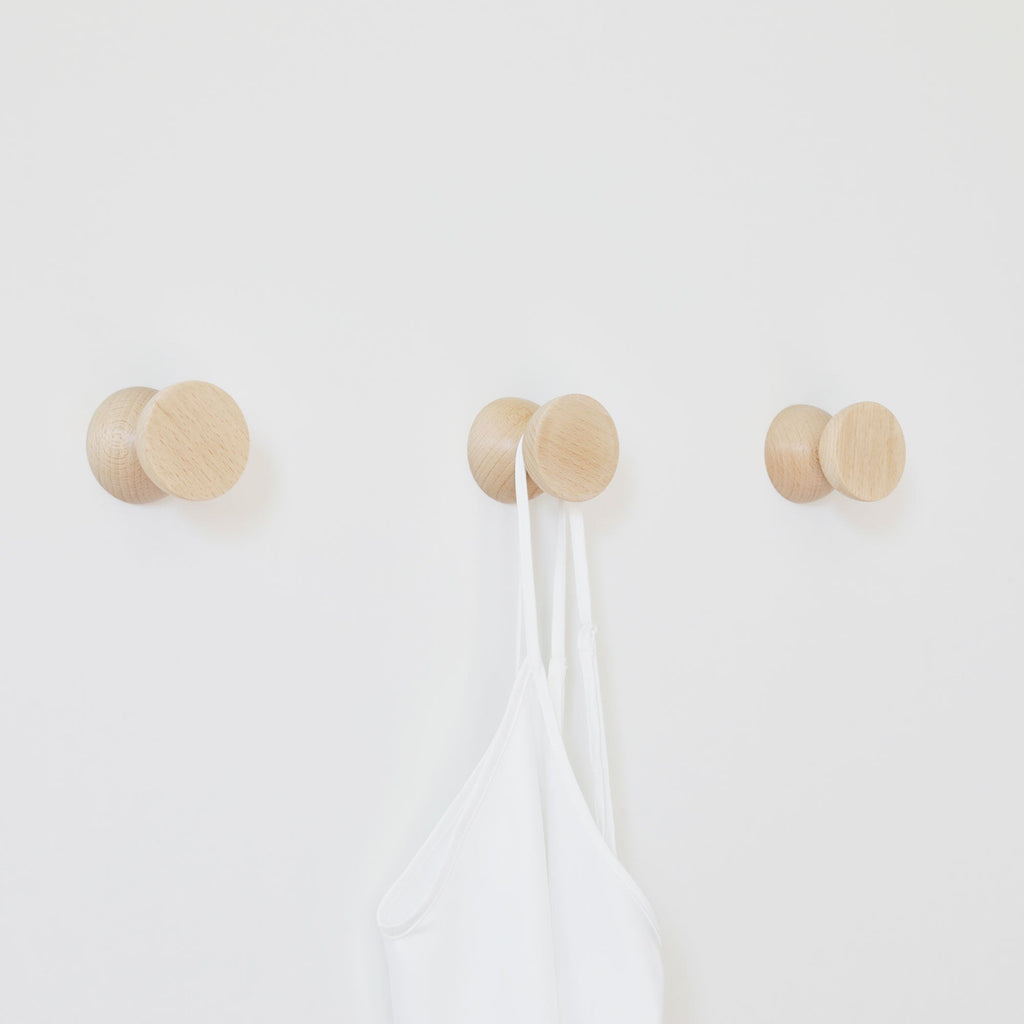 bold modern beech wood wall hook set of 2 in dramatic lighting