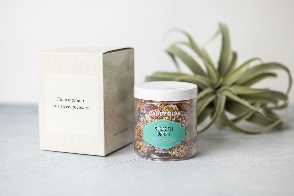 a close-up of the birthday gift set's ceramic mug and lavender soap on a rustic wooden table