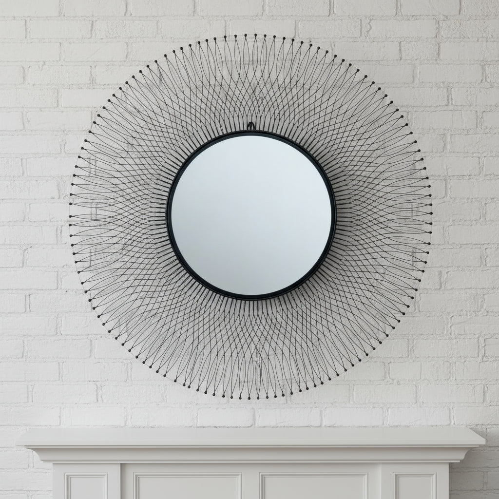 Black geometric wire mirror with industrial design, 109cm circular tempered glass, casting dynamic shadows in modern interiors by Sostter at brixbailey.com
