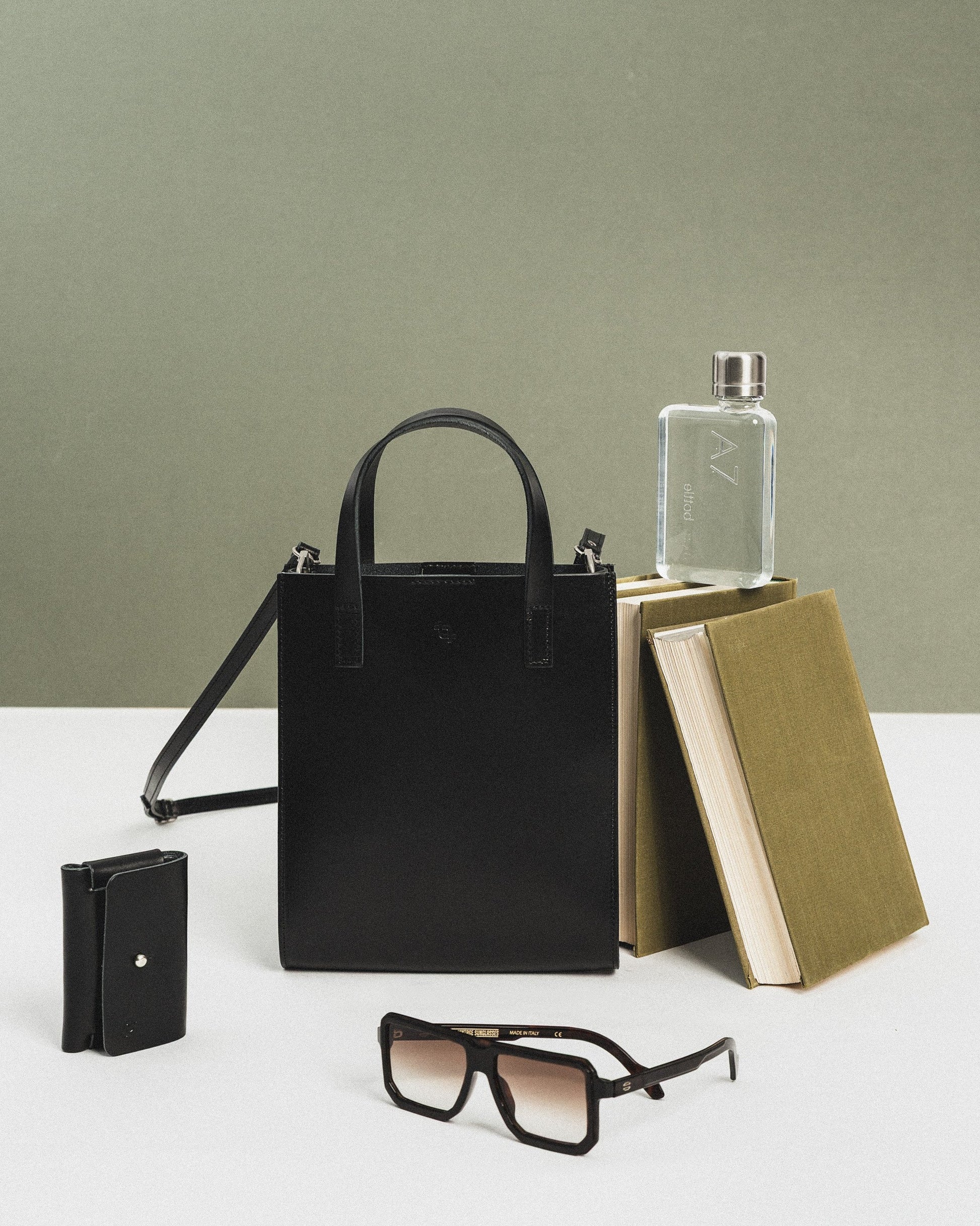 softly lit black leather bucket handbag with a cozy, inviting feel