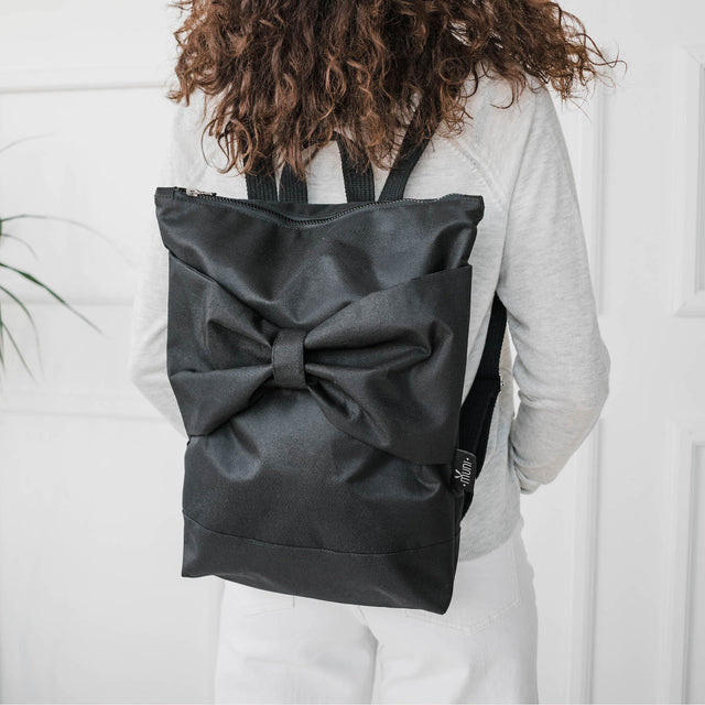 Black Bow Backpack – Elegant, Weather-Resistant & Spacious by Muni at www.brixbailey.com