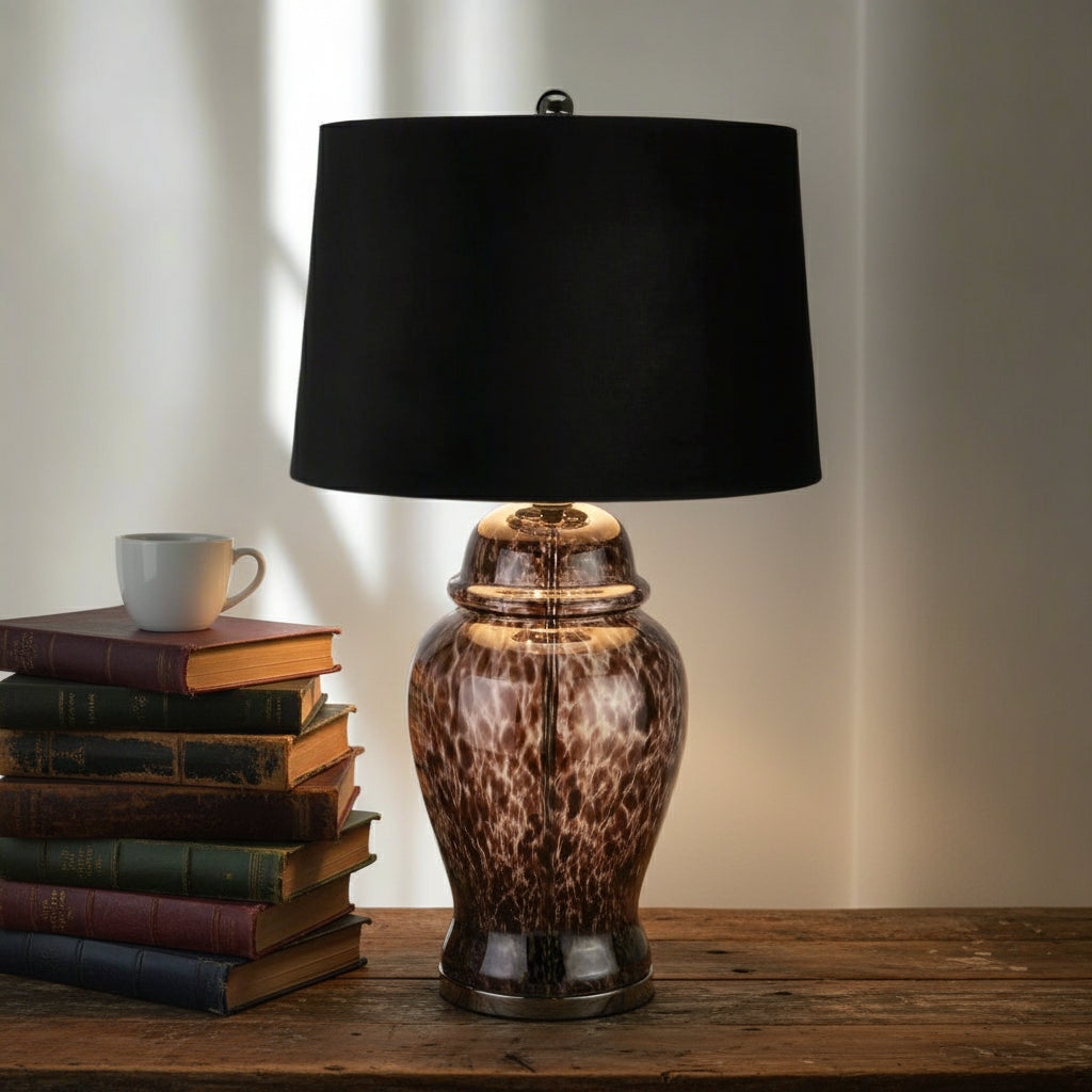Handcrafted black and grey dappled glass table lamp with velvet shade, casting dynamic light patterns in modern decor. by Sostter at brixbailey.com