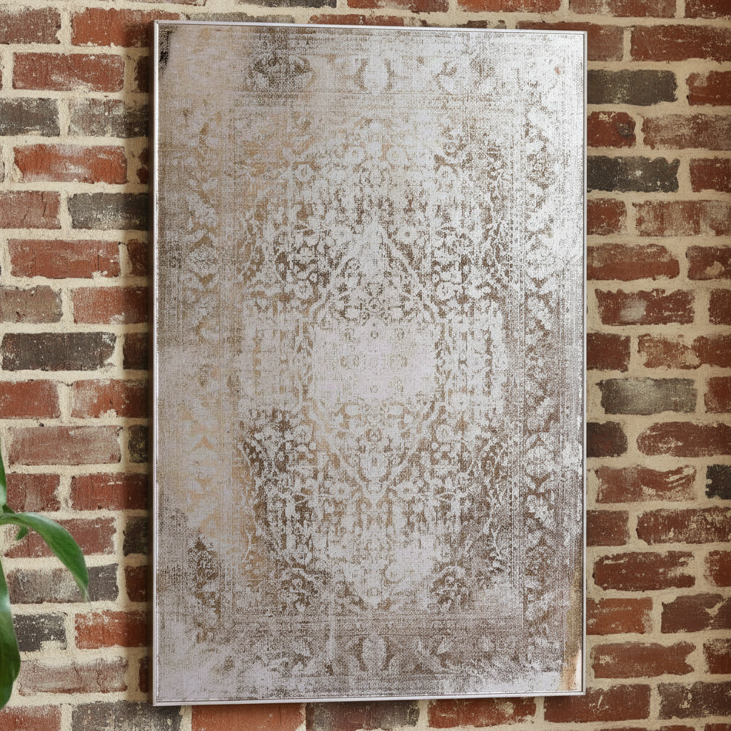 Decorative wall mirror with a textured, distressed pattern on a light background