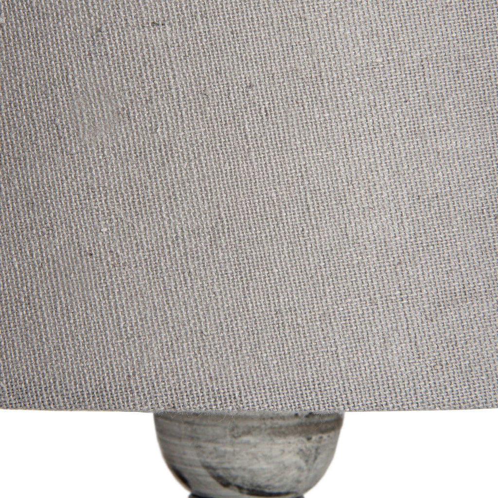 Uthina table lamp with wood base and linen shade in warm beige, perfect for ambient lighting and modern decor by Sostter at brixbailey.com