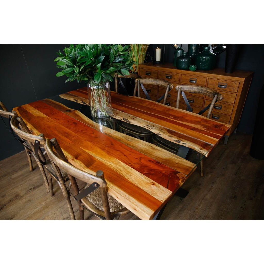 Live edge river dining table with acacia wood slab, tempered glass center, and black steel legs, seats 6-8. by RoomLondon at brixbailey.com