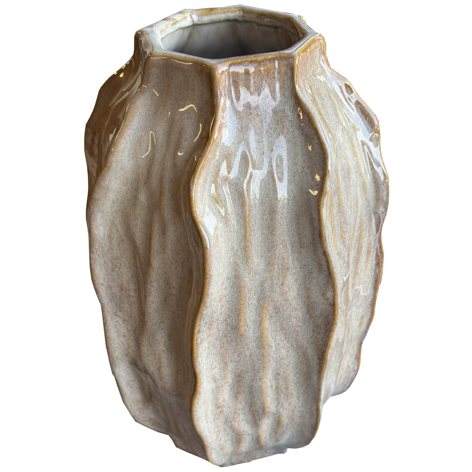 Tall ceramic vase in warm brown with organic seed pod shape, artisanal texture, perfect for modern floral arrangements. by Sostter at brixbailey.com