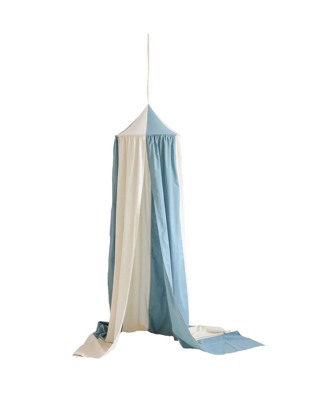 a bold blue circus canopy made of organic cotton and linen hanging confidently over a child's bed