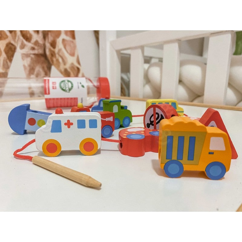 elegant arrangement of eco-friendly wooden threading blocks featuring a detailed ambulance and fire truck