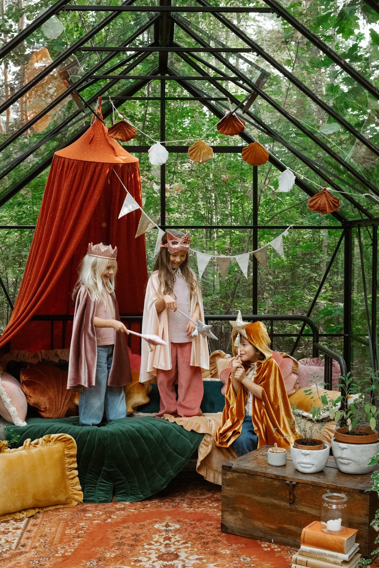 elegant pink velvet cat mask with sequins, displayed on a dark velvet background