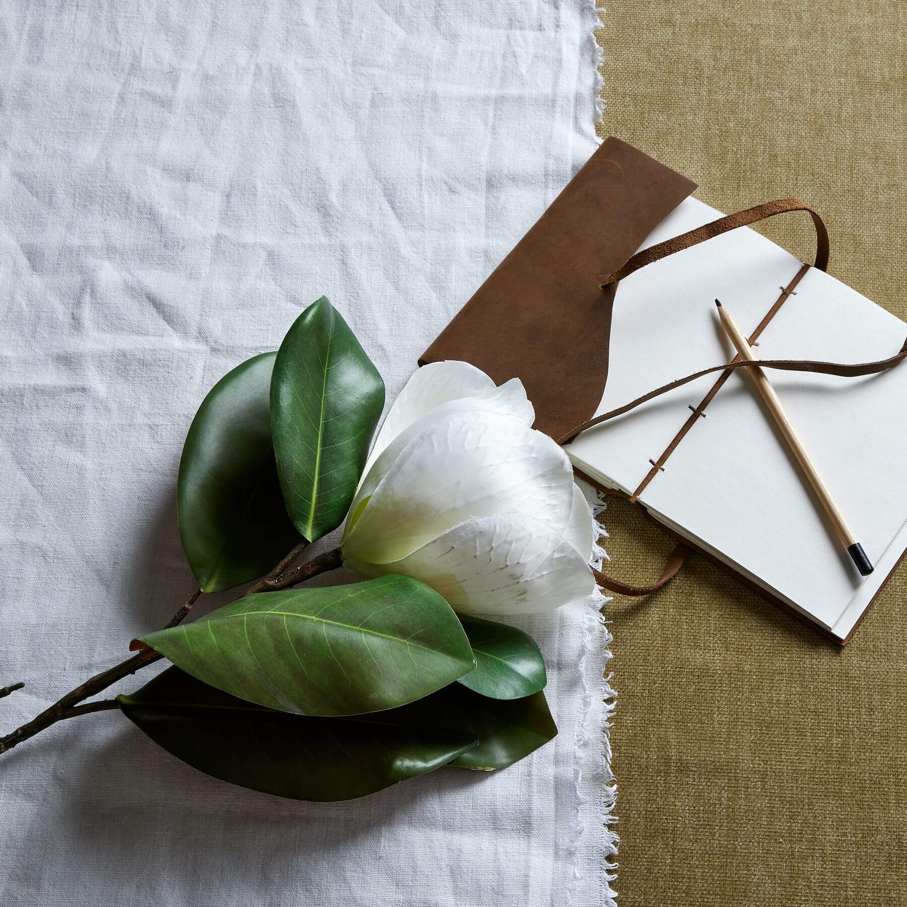 White magnolia artificial stem with lifelike petals and veining, 78cm tall, perfect for home decor arrangements by RoomLondon at brixbailey.com