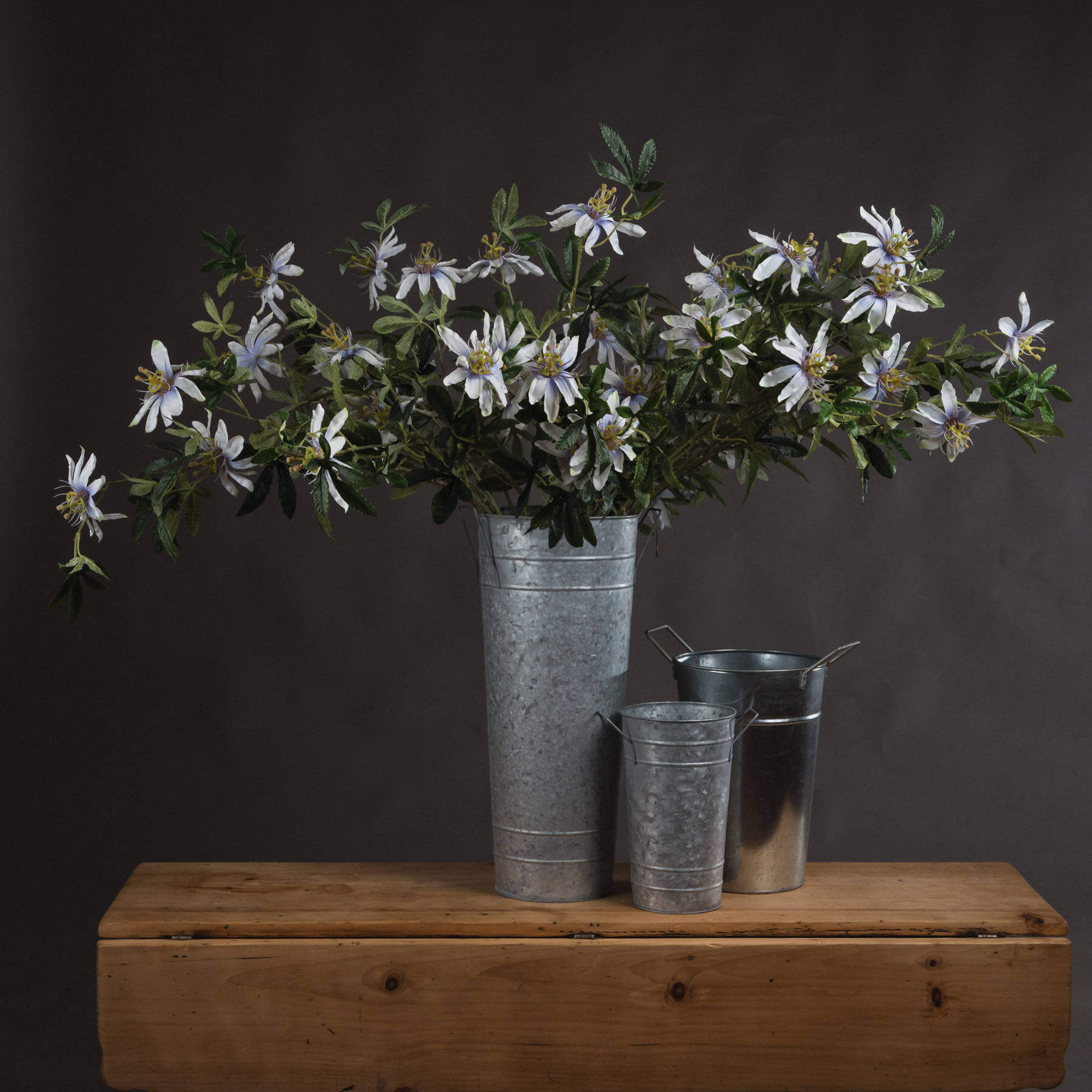 White artificial passion flower spray with green foliage, 89 cm tall, lifelike petals and corona filaments for home decor by sostter at brixbailey.com
