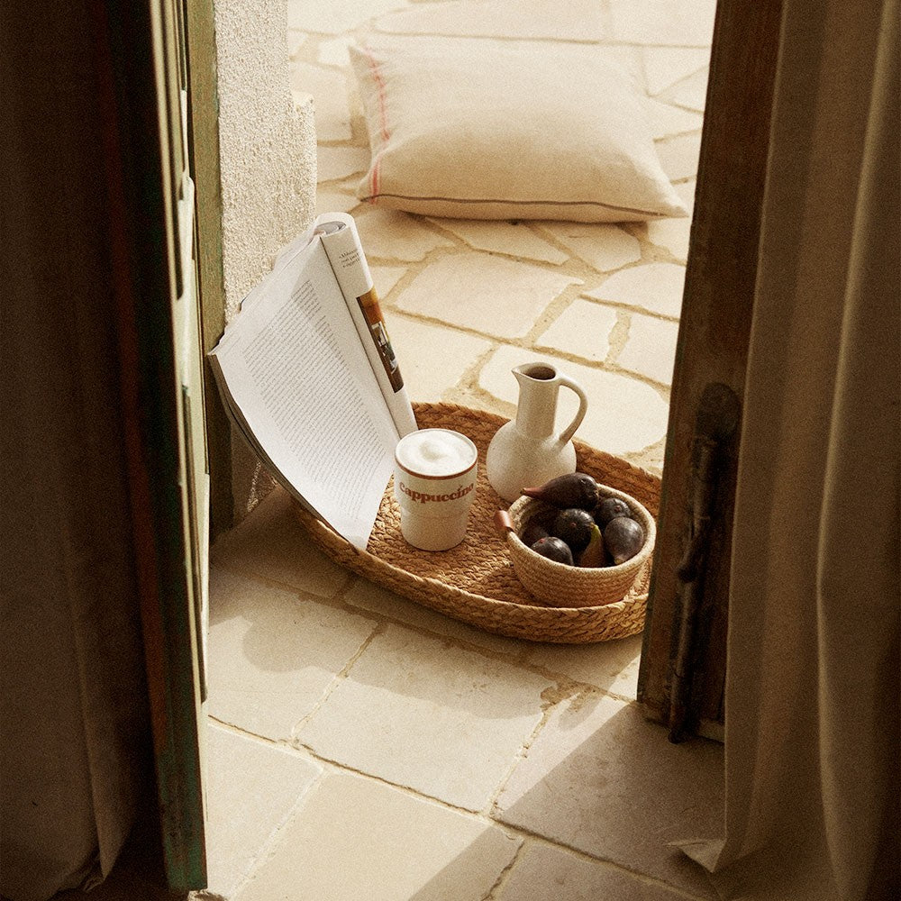 elegant ceramic cappuccino mug in soft morning light on a rustic table
