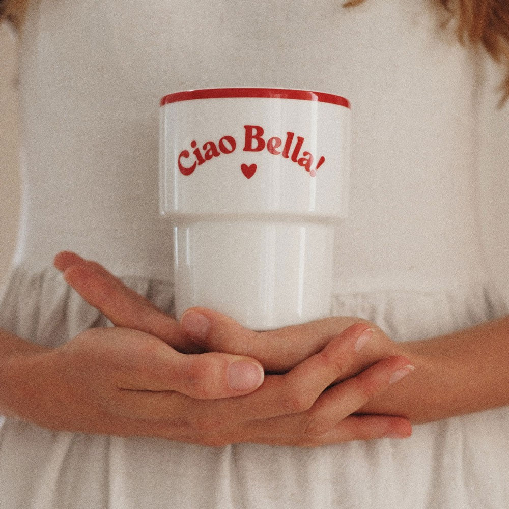 bold ciao bella ceramic mug with vibrant italian typography on a rustic table