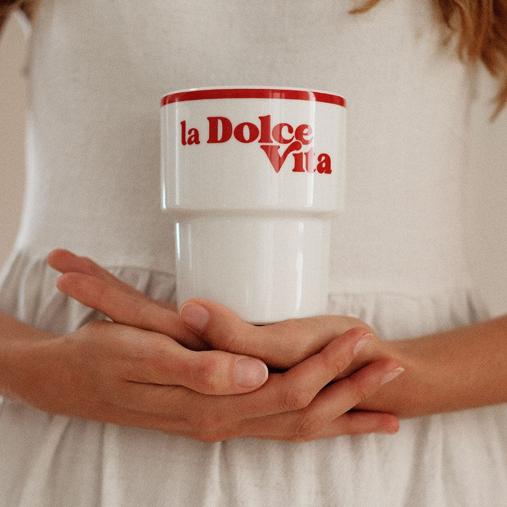 bold la dolce vita ceramic mug held confidently in hand against a sun-drenched italian backdrop