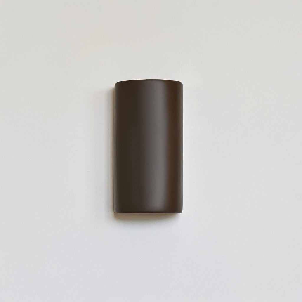handcrafted warm brown ceramic wall light showing e27 socket and installation details