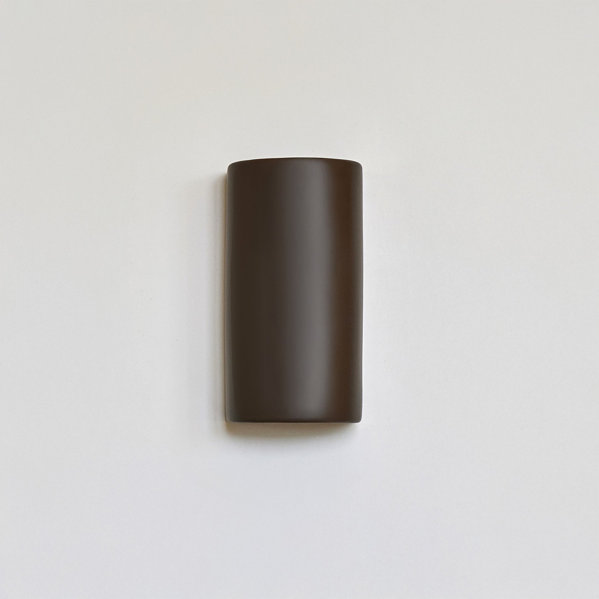 handcrafted warm brown ceramic wall light showing e27 socket and installation details