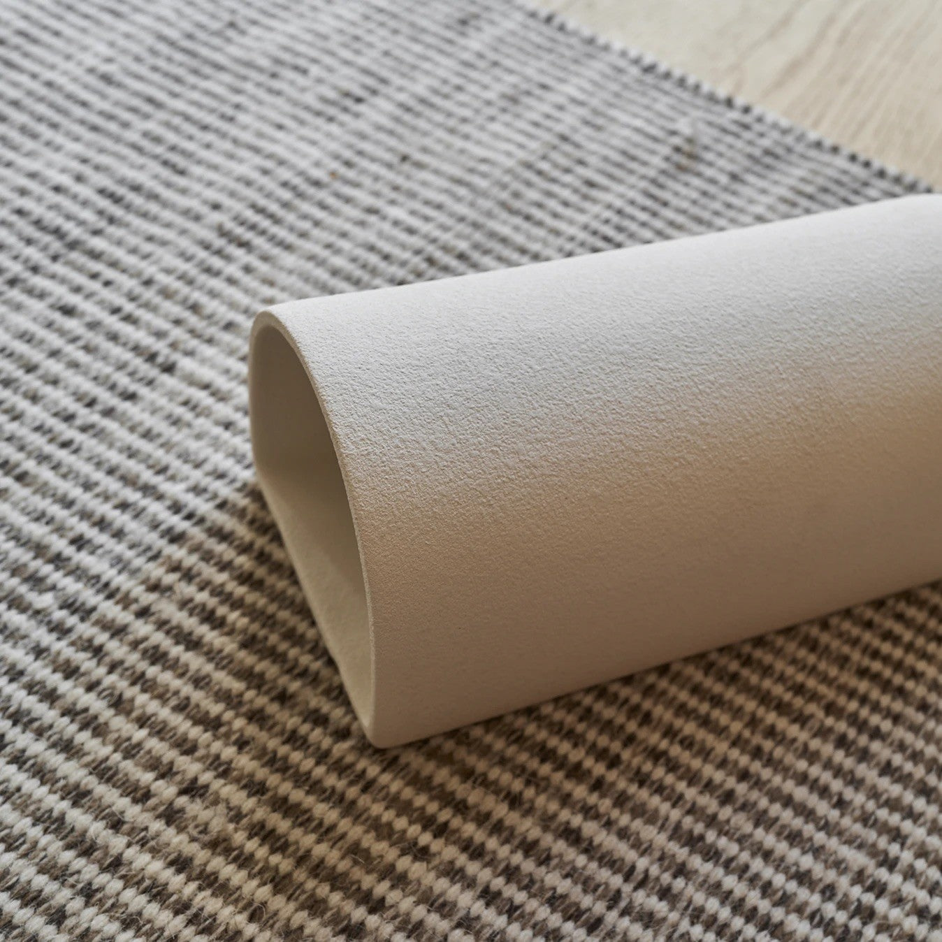 matte white ceramic wall light shown in a hallway, demonstrating its soft, practical glow for everyday use