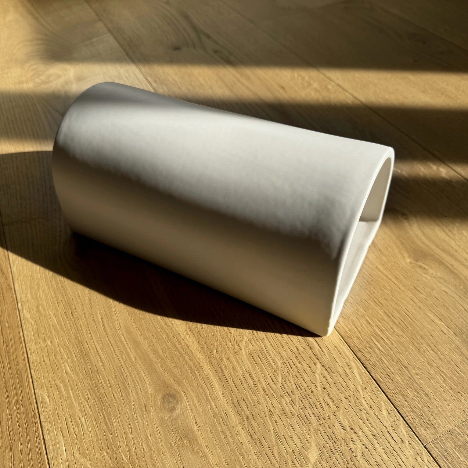 off white ceramic wall light shown with an e27 led bulb for easy installation