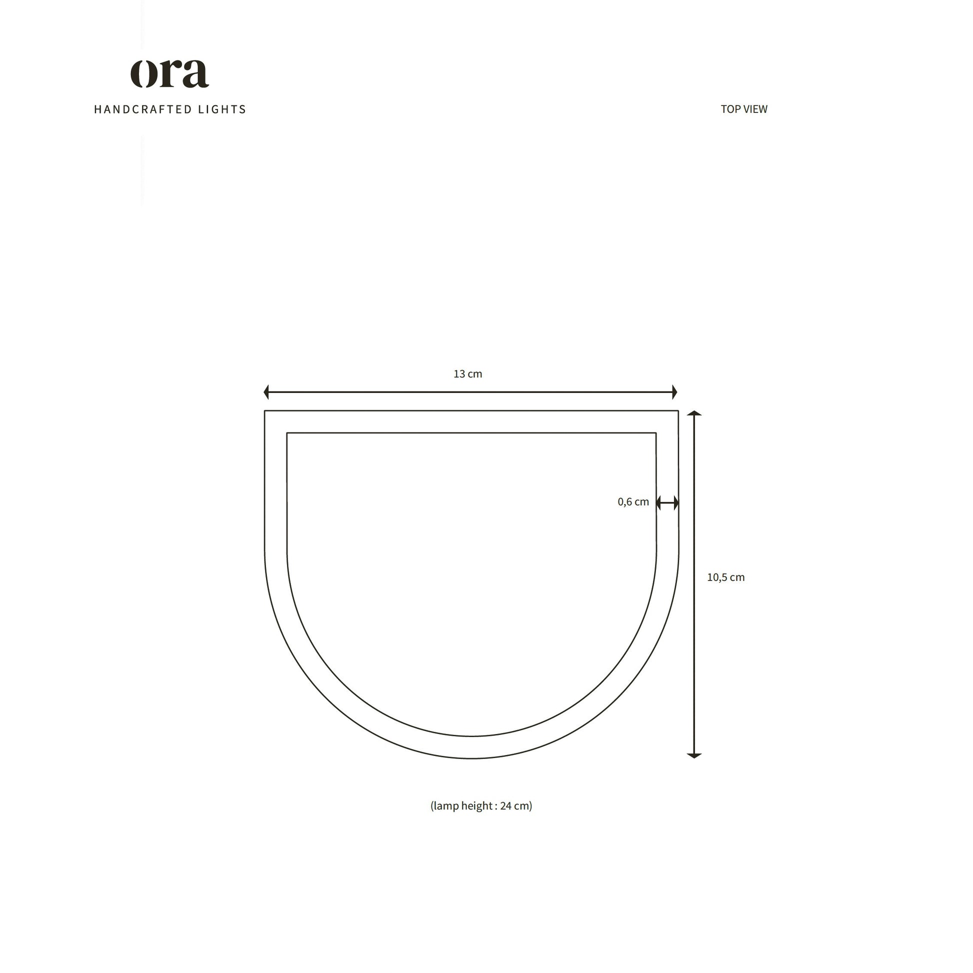 handcrafted raw white ceramic wall light casting a soft glow in a nursery
