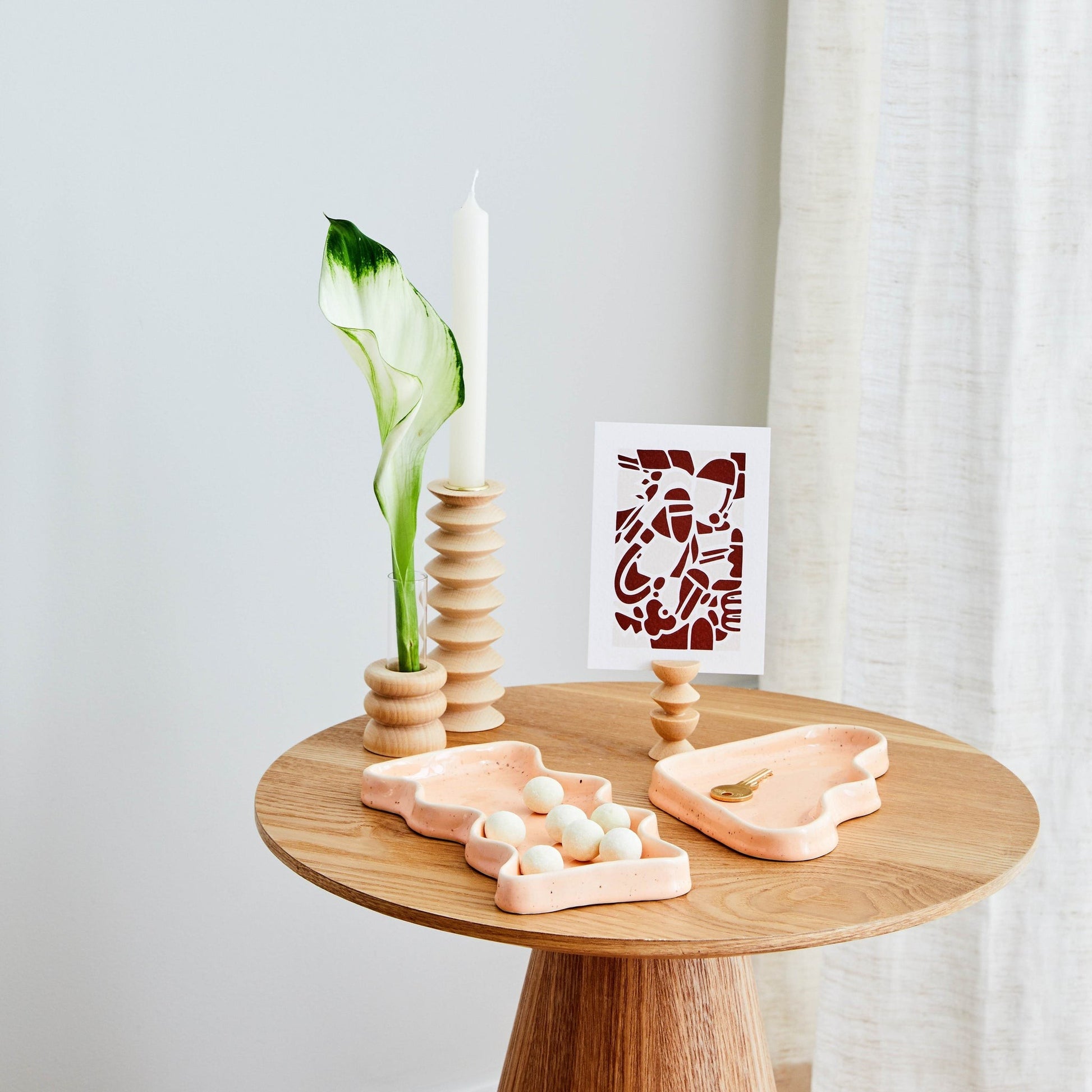 playful peach triangle ceramic tray with speckled glaze, perfect for keys or decor, shot from a fun angle