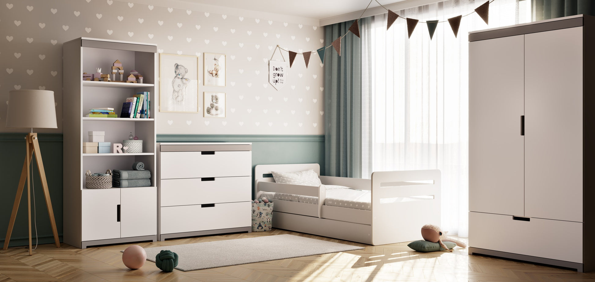 softly lit tomi chest of drawers in a cozy nursery with its smooth grey and white finish