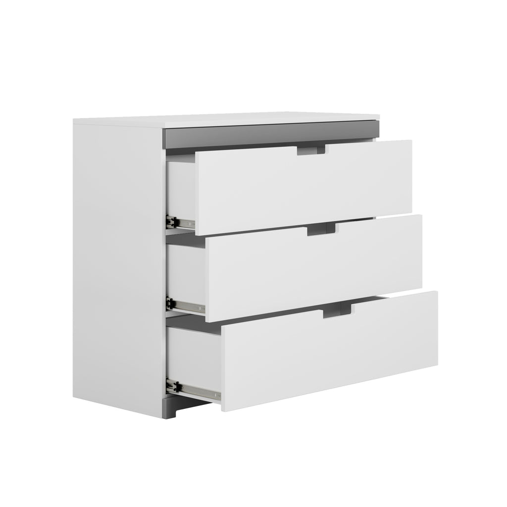 tomi 3-drawer chest in a bright nursery with morning light highlighting its smooth white finish and grey decorative panel