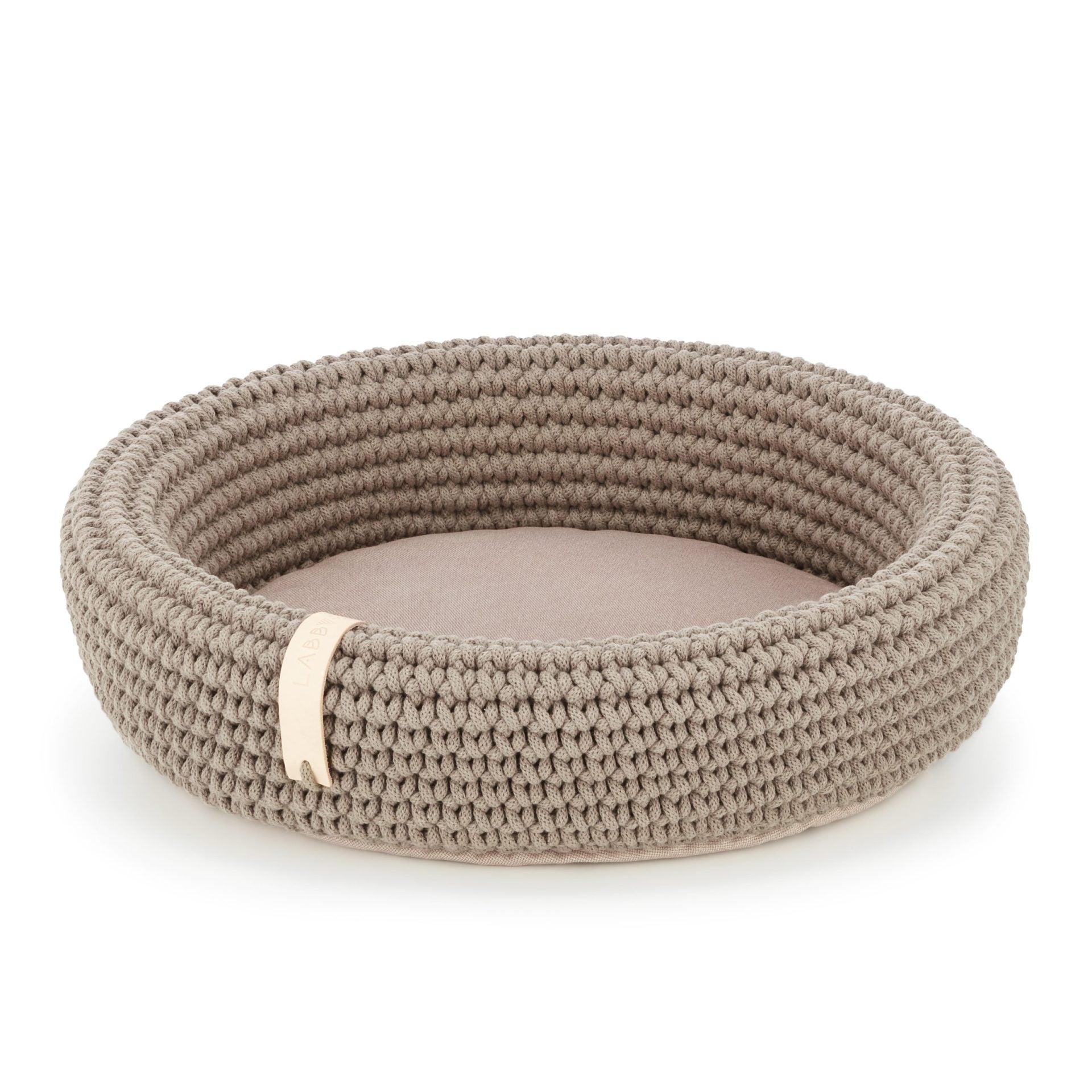 a playful cat peeking from the cozy light brown coco cotton rope bed