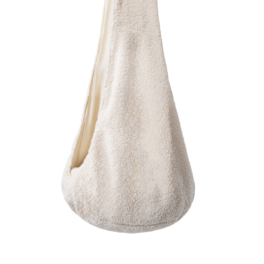 elegant textured fabric cocoon swing in a refined home library setting