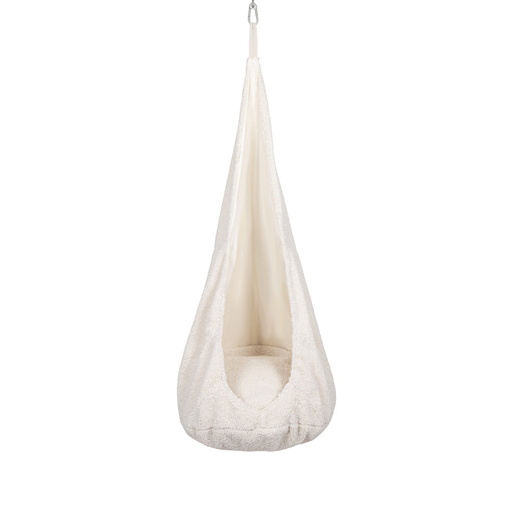 a bold statement in home decor - the textured cocoon swing for kids hangs confidently in a modern room