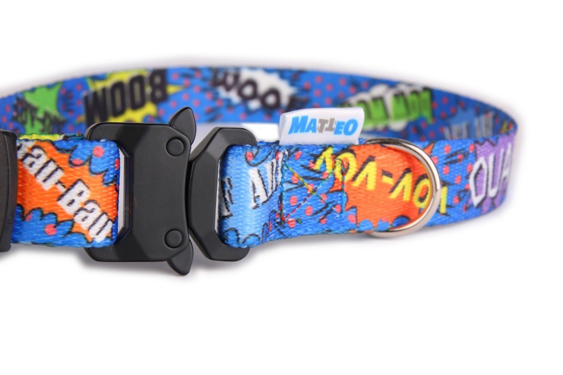 elegant close-up of a blue graffiti dog collar with a gleaming nickel-plated metal buckle