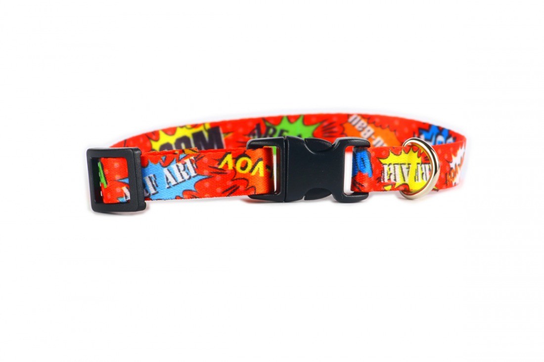 a playful dog modeling the stylish red graffiti collar with its durable nickel-plated buckle