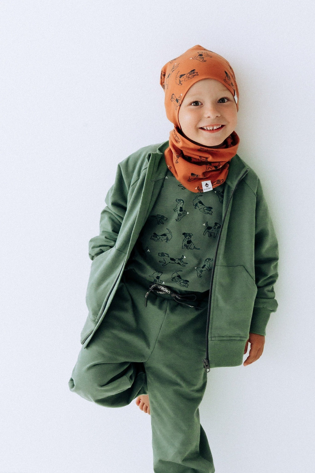 a bold close-up of the copper dogs kids beanie in warm morning light