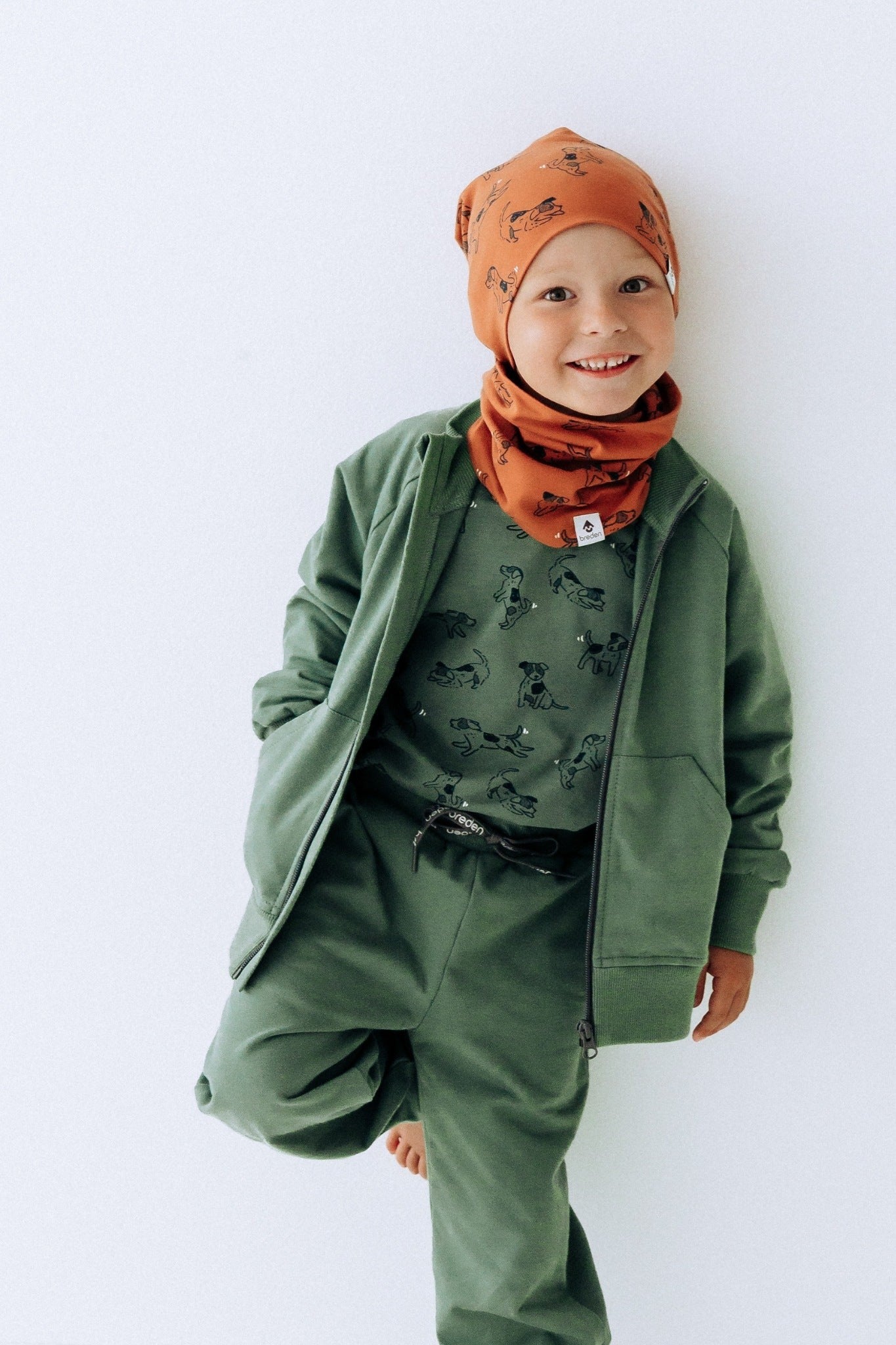 a bold close-up of the copper dogs kids beanie in warm morning light