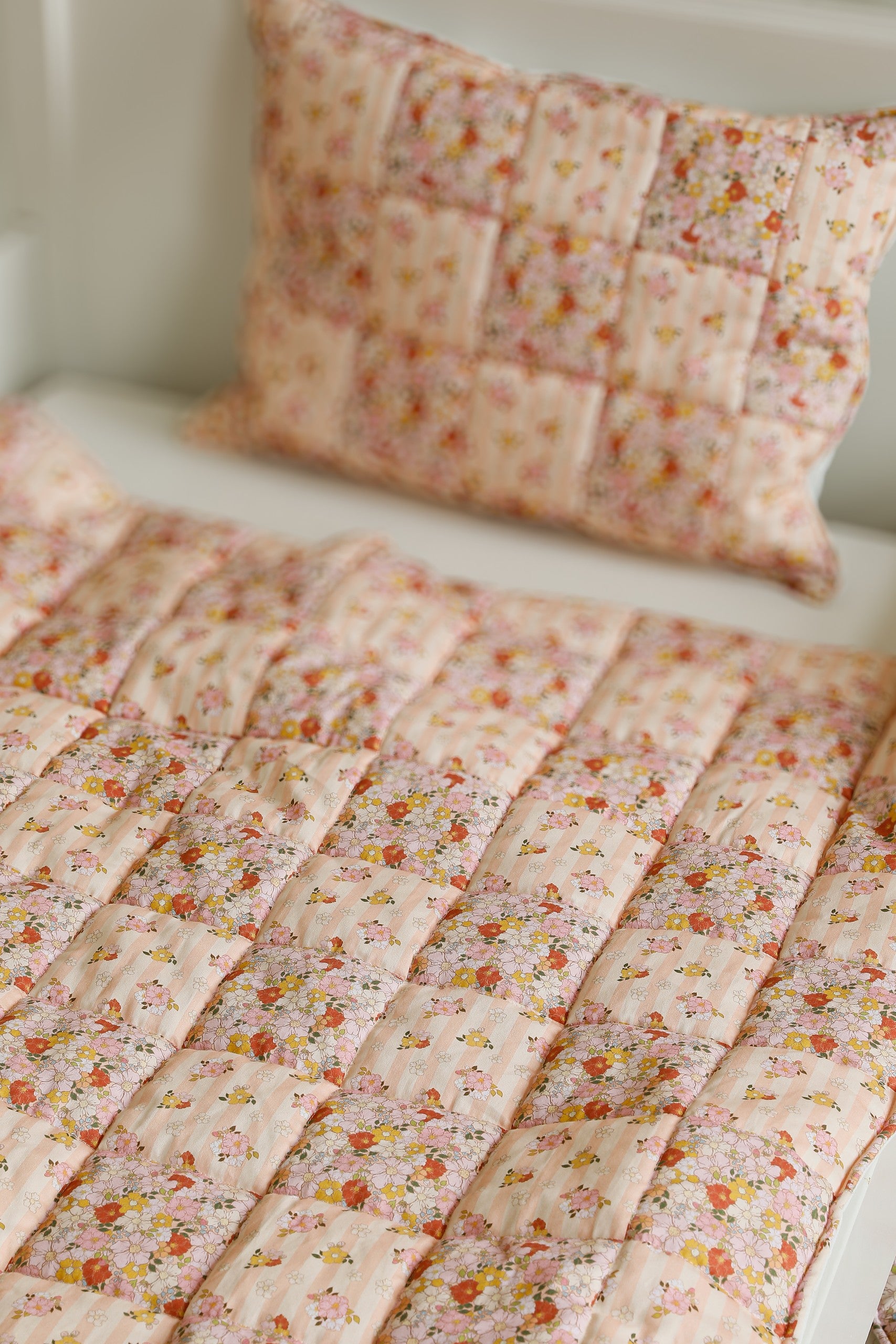 elegant spring garden cotton quilted blanket and pillow set with patchwork details, soft pastel tones