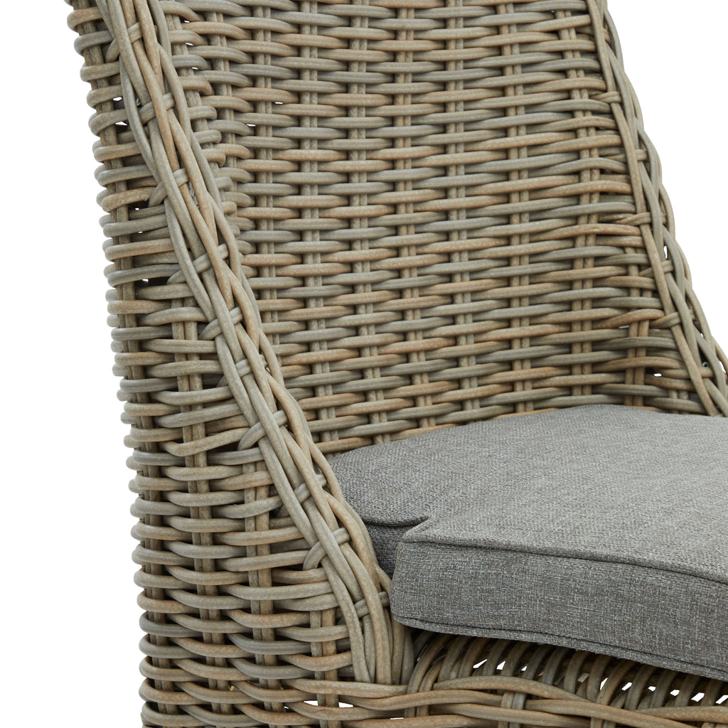 Handwoven beige HDPE wicker outdoor dining chair with aluminum frame and quick-dry cushions, Mediterranean style by Sostter at brixbailey.com