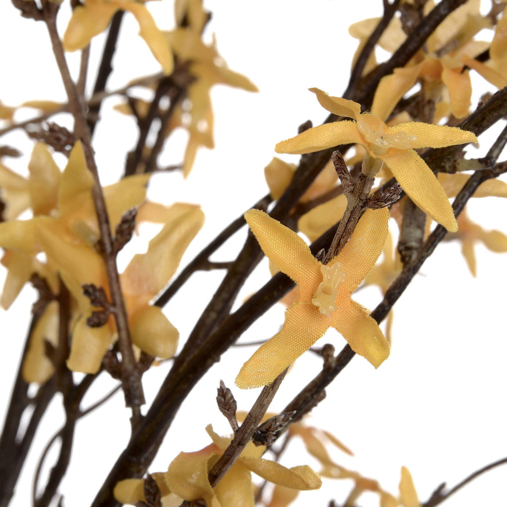 close-up of a realistic yellow forsythia stem showing its durable plastic construction