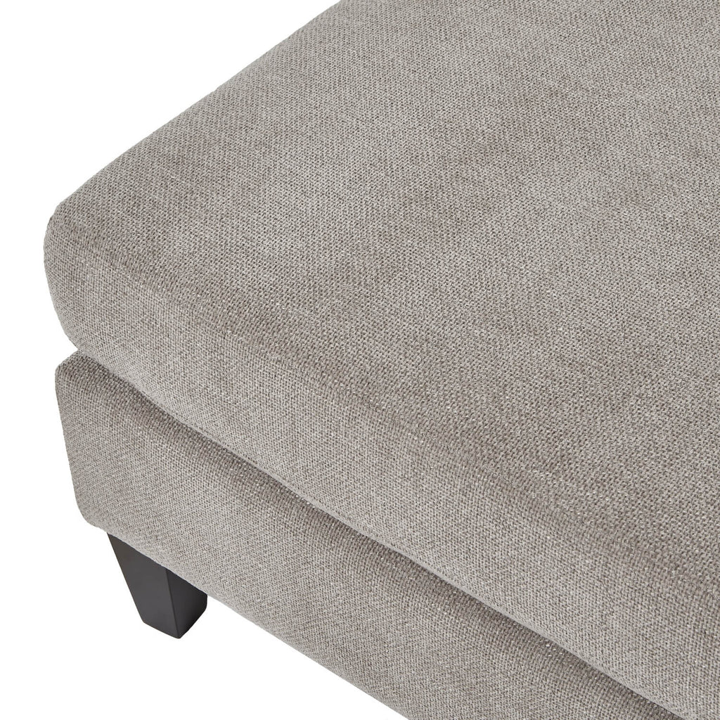Taupe velvet ottoman foot stool with wooden legs, plush cushioning, and modern farmhouse design by sostter at brixbailey.com