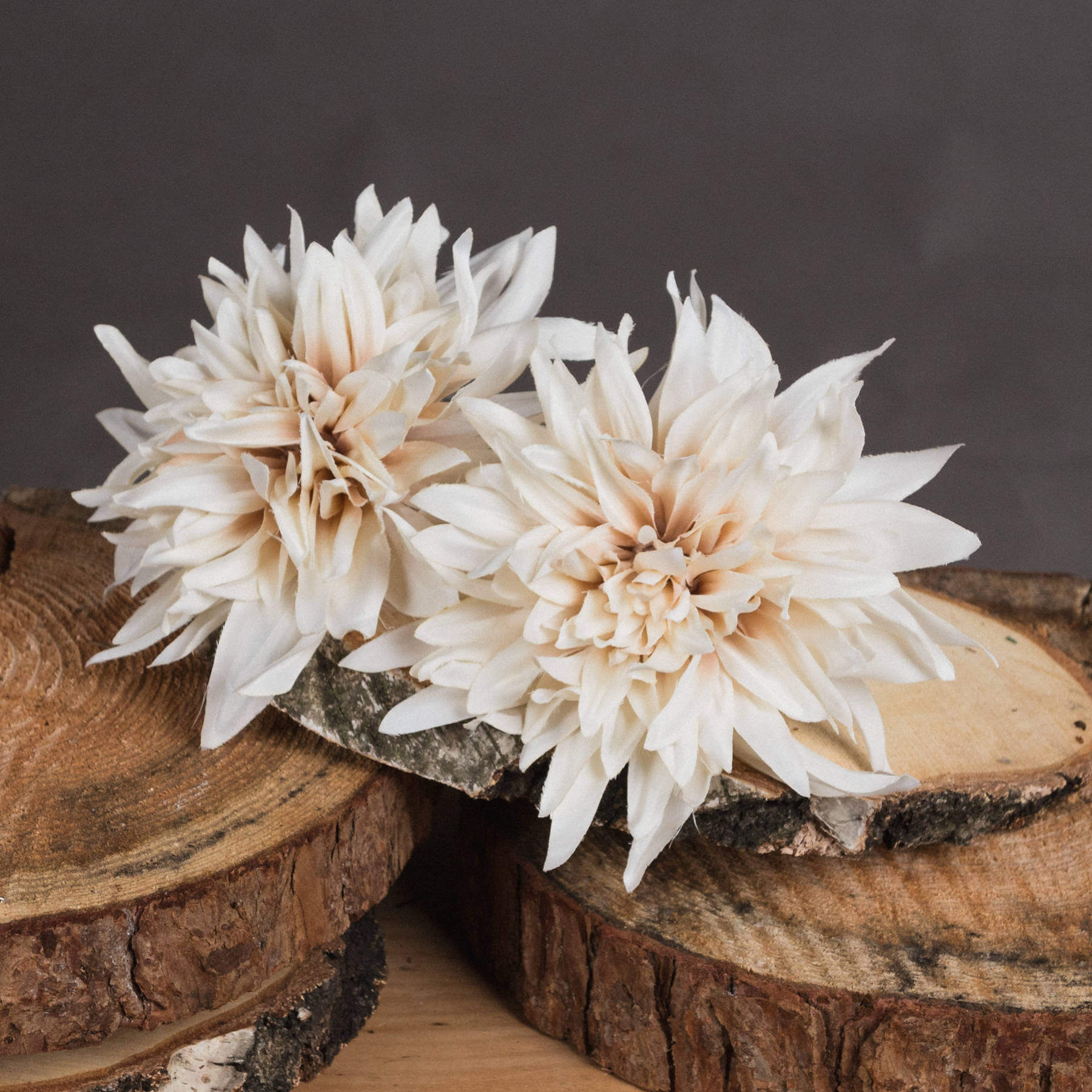 Cream artificial dahlia flower with warm orange tones, lifelike petals, and neutral cafÃ© au lait hues for home decor. by RoomLondon at brixbailey.com