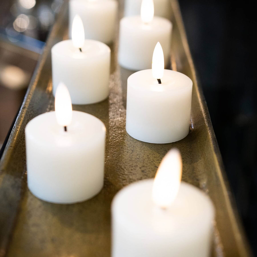 White LED tealight with realistic flickering flame, battery-operated flameless candle for worry-free ambiance by RoomLondon at brixbailey.com
