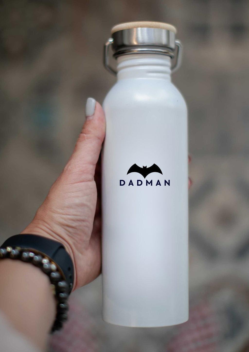 a bold close-up of the dadman thermos with its black stainless steel and bamboo lid