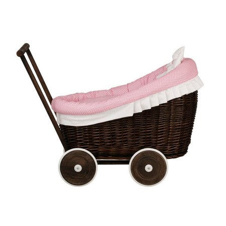 close-up of the dark wicker pram's cozy pink bedding set, ready for a doll