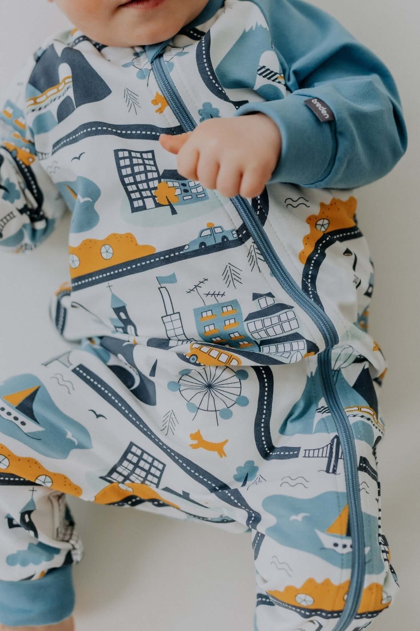 close-up of the baby sleepsuit freda's two-way zipper and ribbed cuffs for easy diaper changes